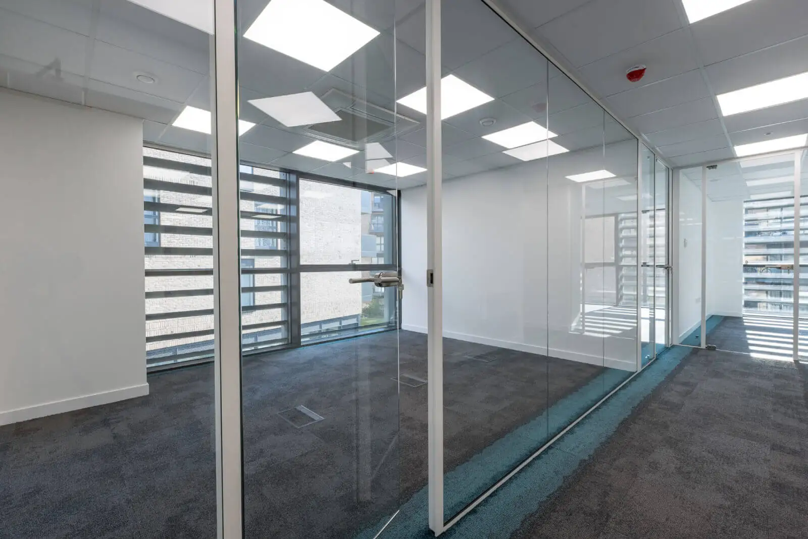 Godleys office space design with designer furniture and single glazed framed glass partitions 7