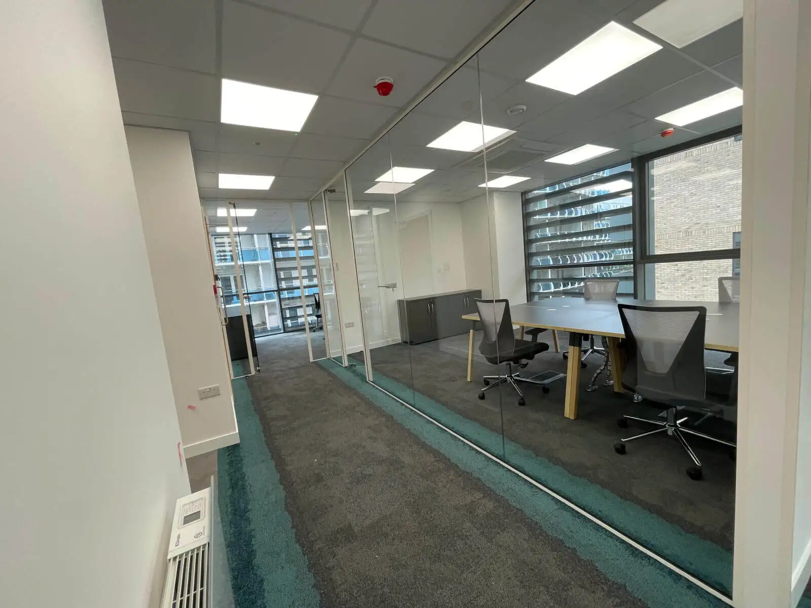 Godleys office space design with designer furniture and single glazed framed glass partitions