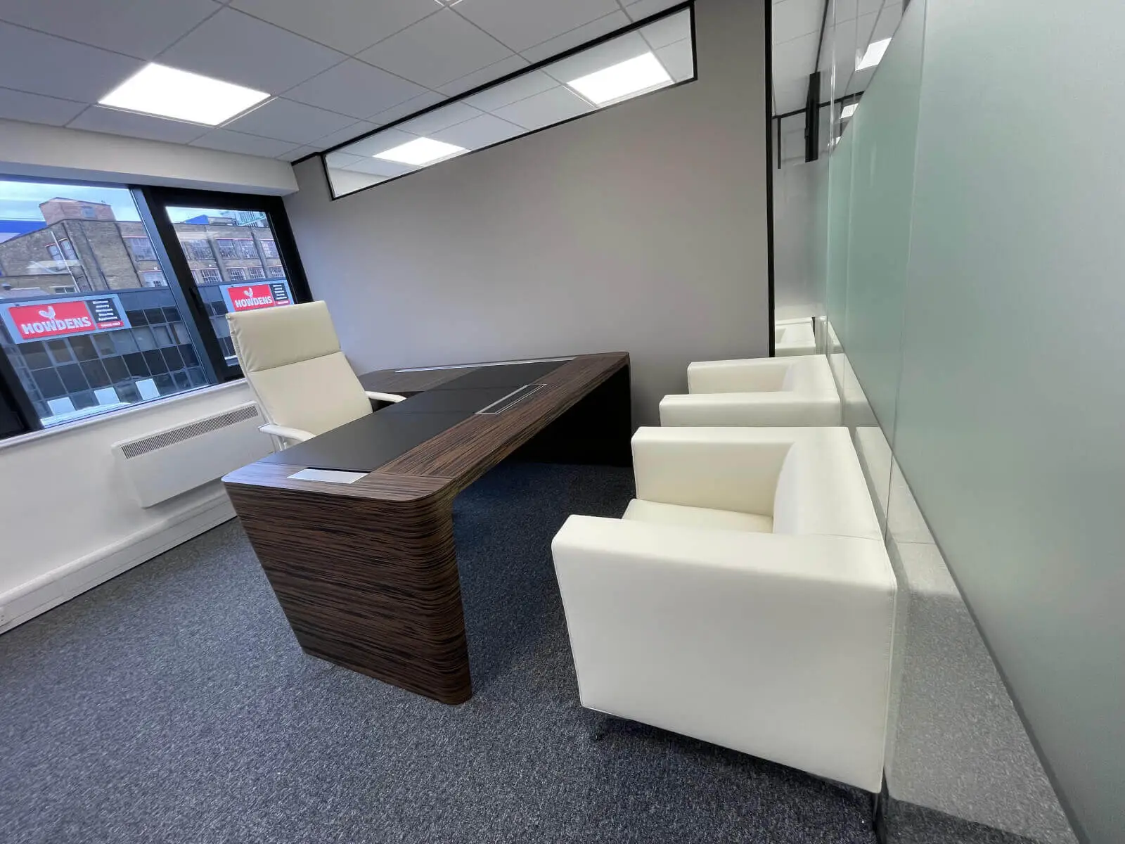 IOC office space with designer furniture and single glazed framed glass doors 23