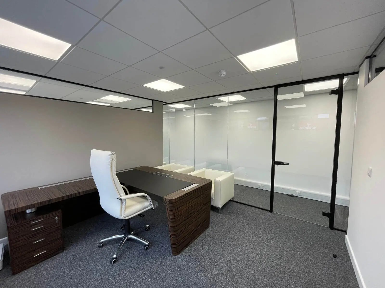 IOC office space with designer furniture and single glazed framed glass doors 24