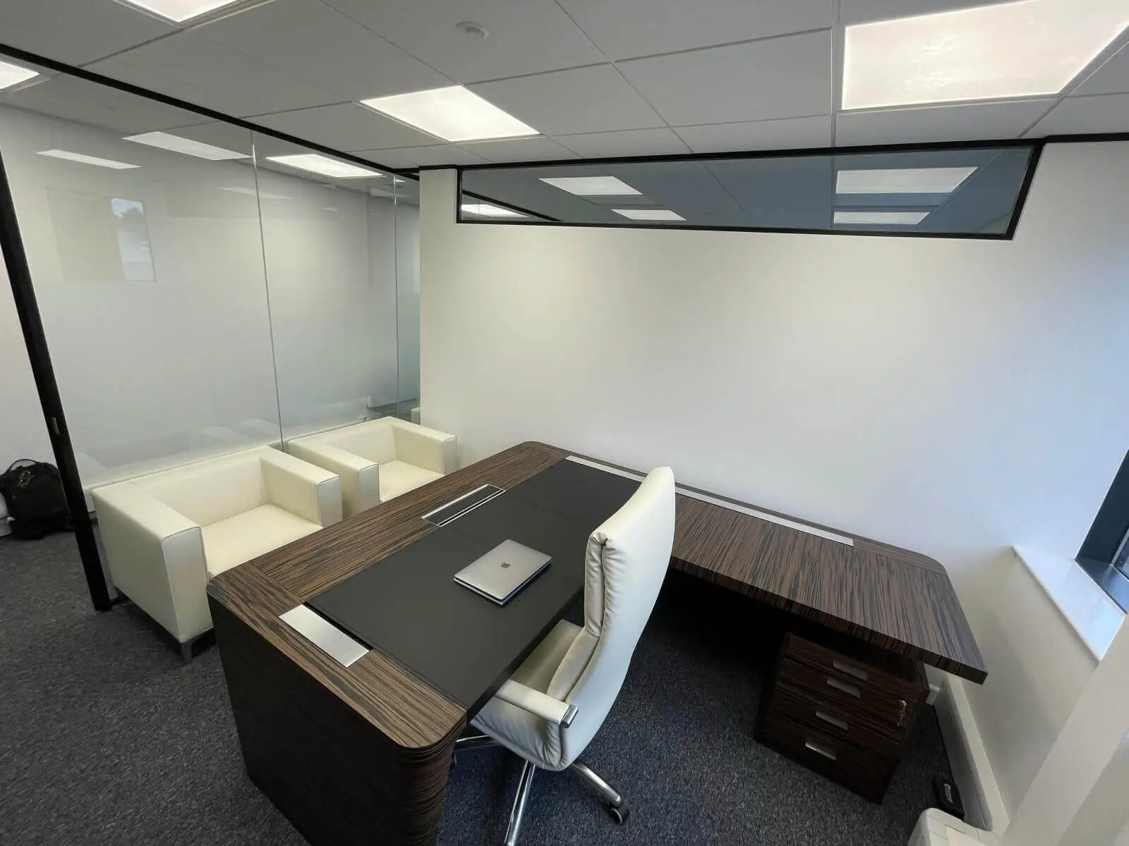 IOC office space with designer furniture and single glazed framed glass doors 29