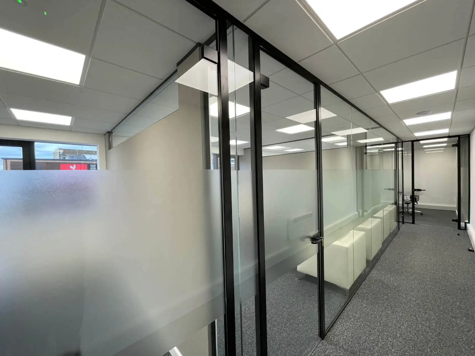 IOC office space with designer furniture and single glazed framed glass doors 6