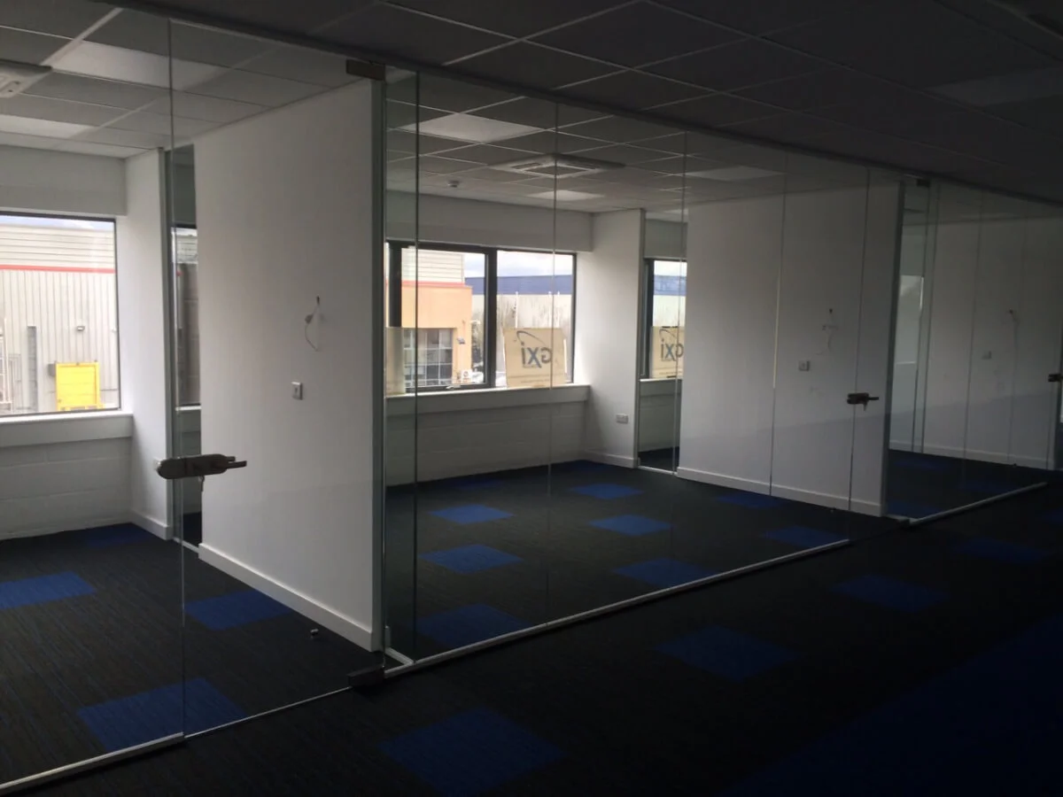 Nasco office space with designer flooring and single glazed solid stud wall glass partitions 42