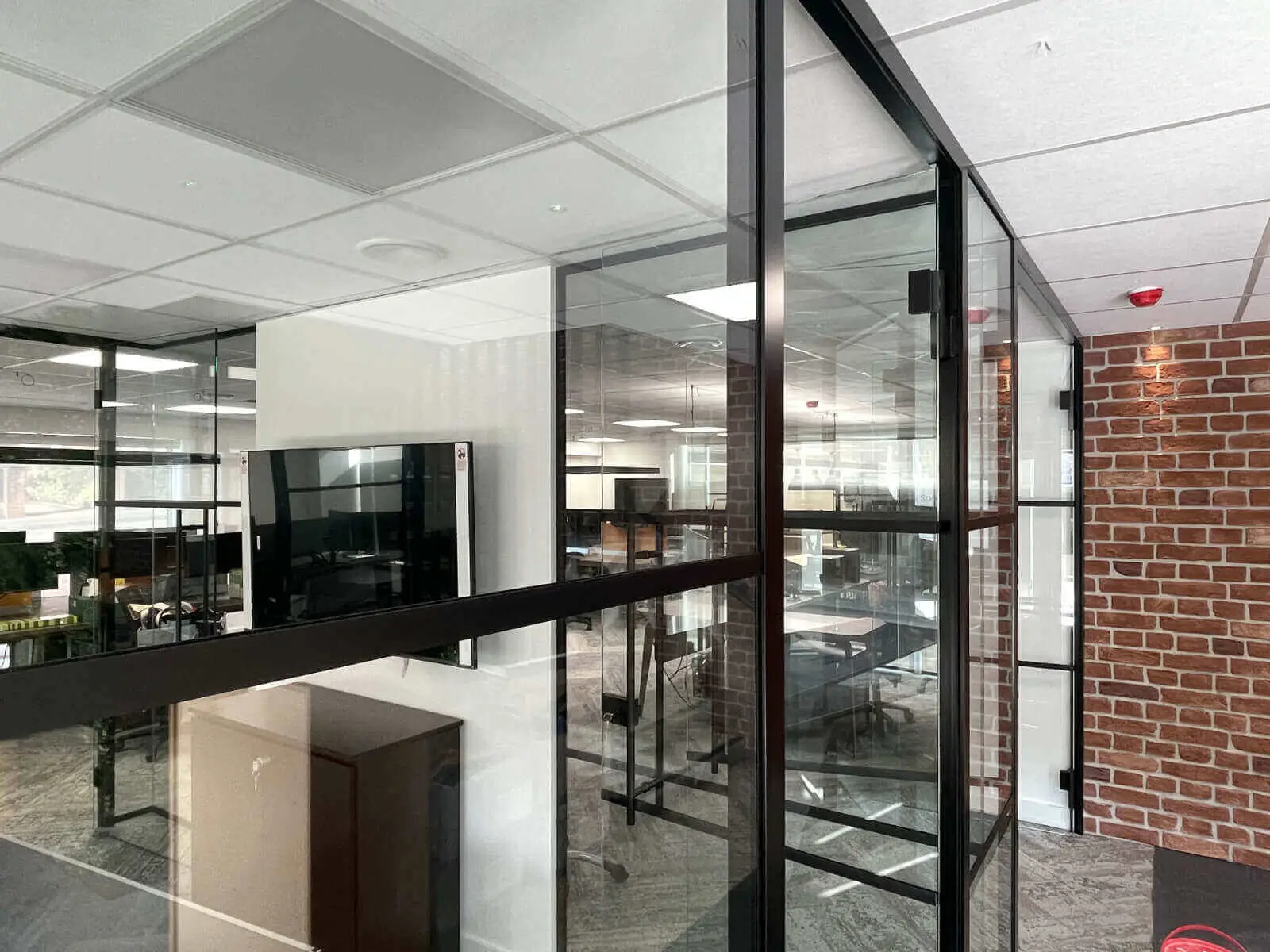 Prideview Properties office space with designer furnitures and black framed glass partitions 7