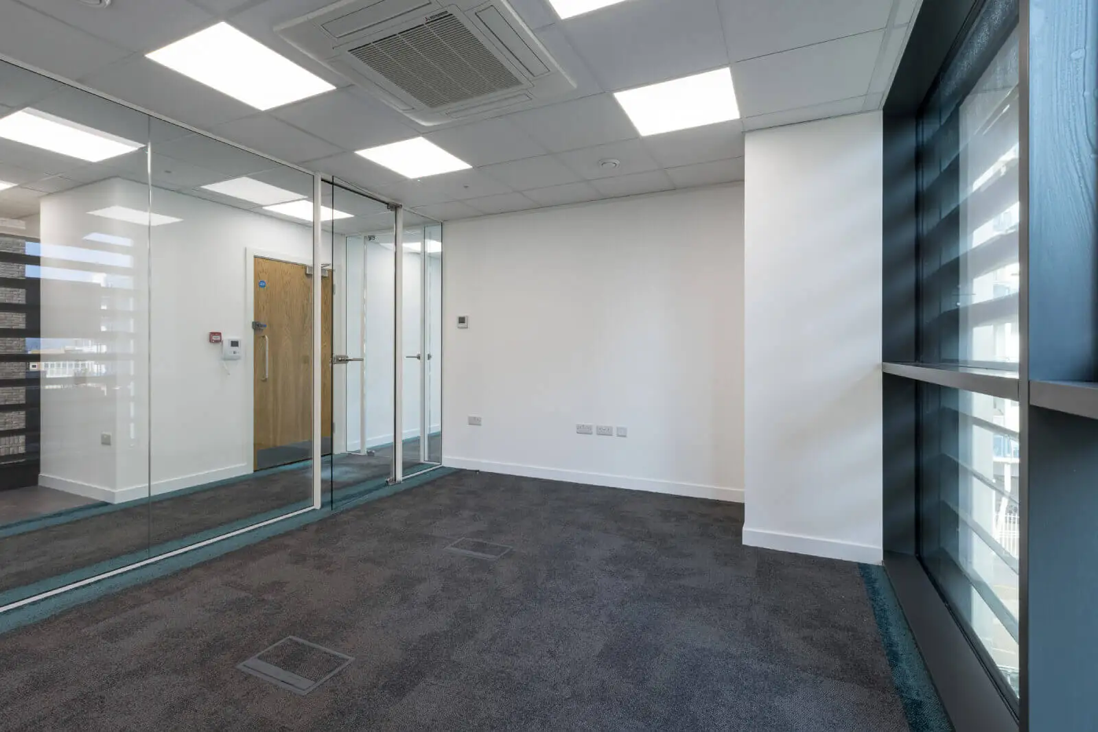 Godleys office space design with designer furniture and single glazed framed glass partitions 10