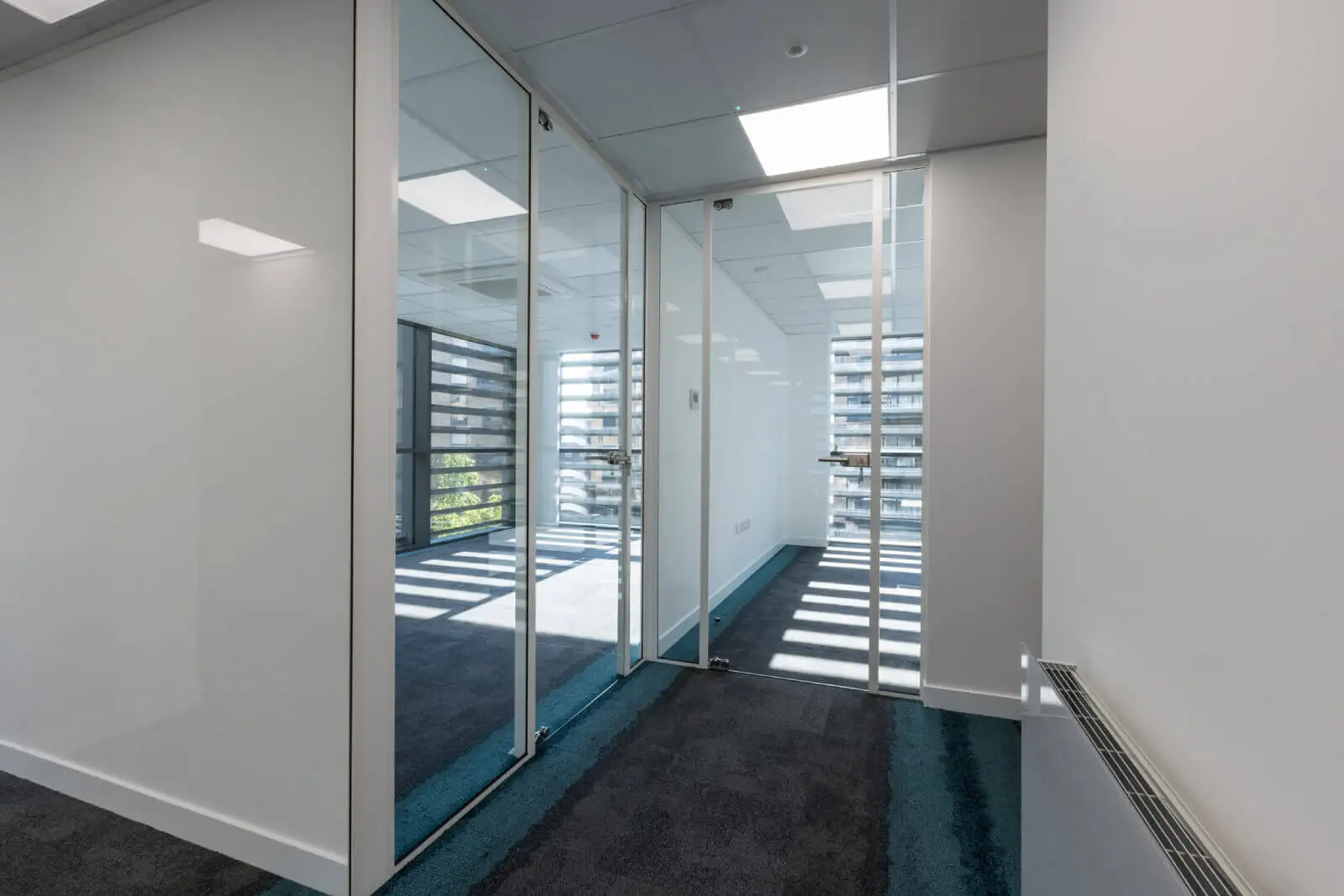 Godleys office space design with designer furniture and single glazed framed glass partitions 12