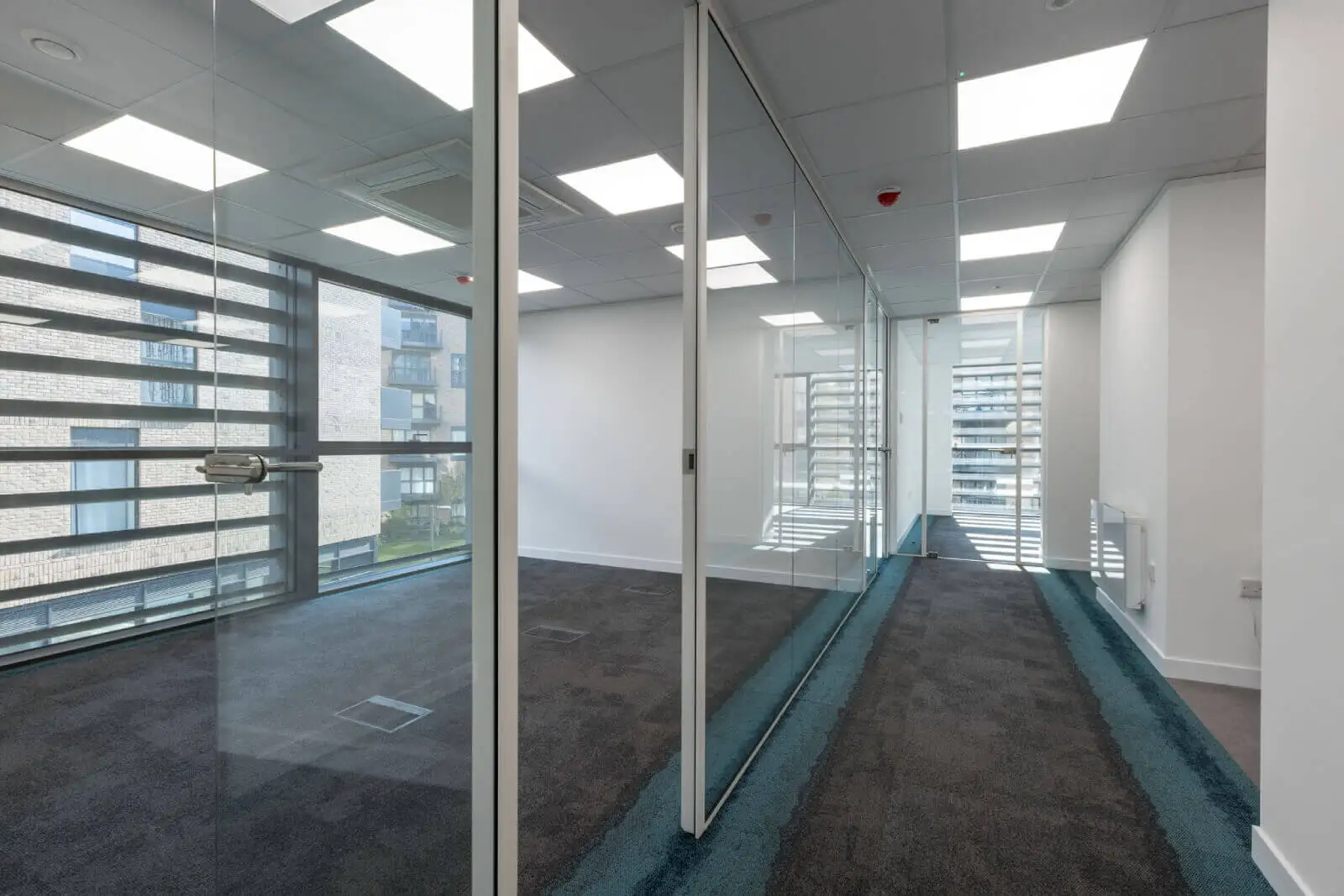 Godleys office space design with designer furniture and single glazed framed glass partitions 4