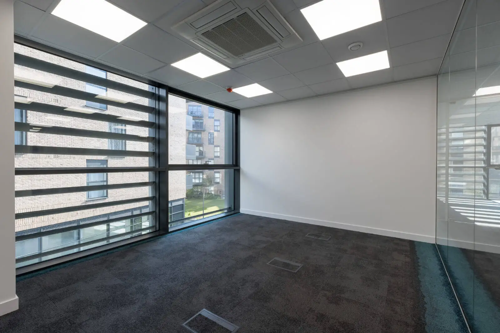 Godleys office space design with designer furniture and single glazed framed glass partitions 8