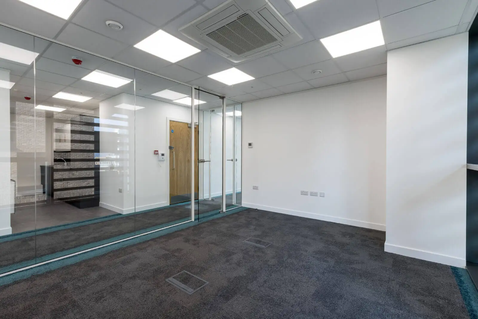 Godleys office space design with designer furniture and single glazed framed glass partitions 9